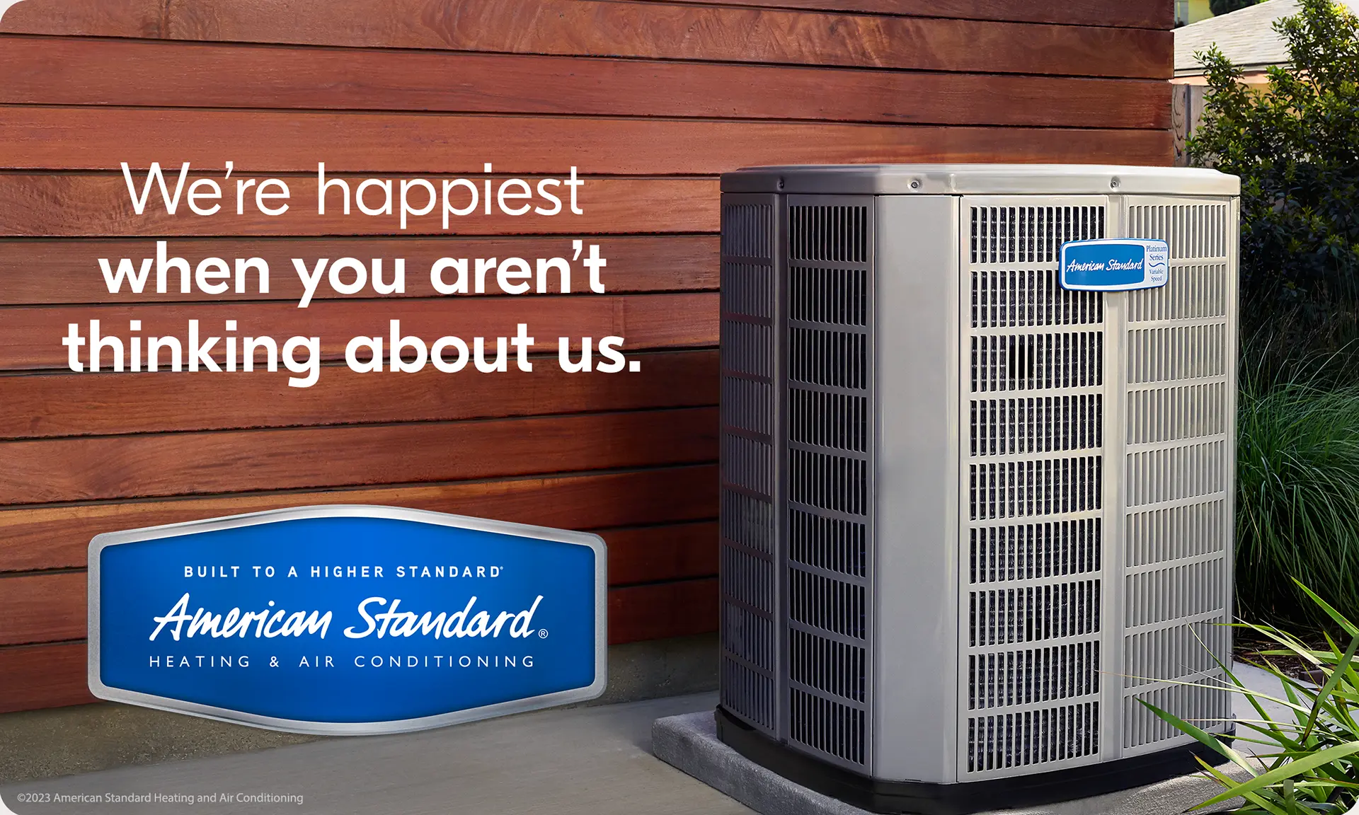 American Standard outdoor HVAC unit with text reading 'We're happiest when you aren't thinking about us,' promoting the Happy Home Club