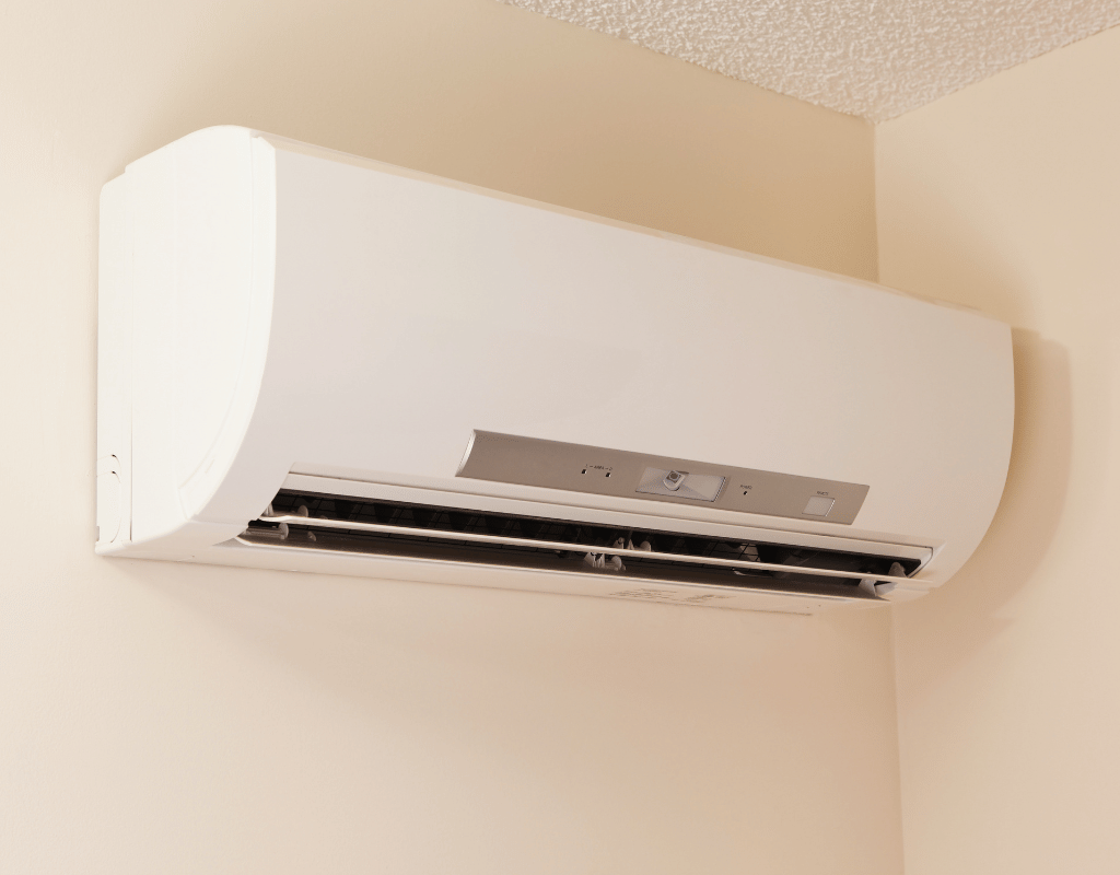 White ductless minisplit indoor wall unit mounted in a home corner