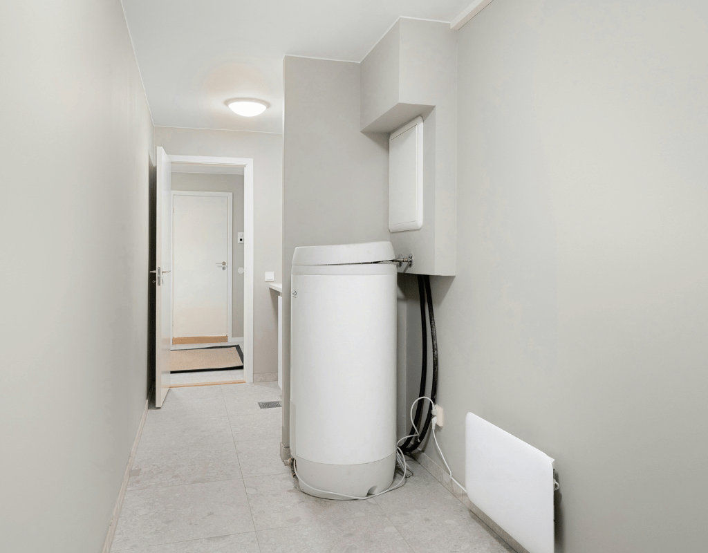 Newly installed tank water heater in a Central Michigan home hallway